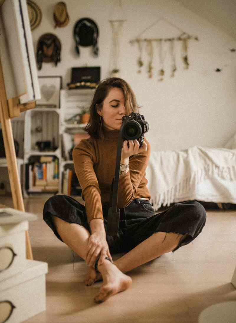 Photographer holding a camera, stand-in