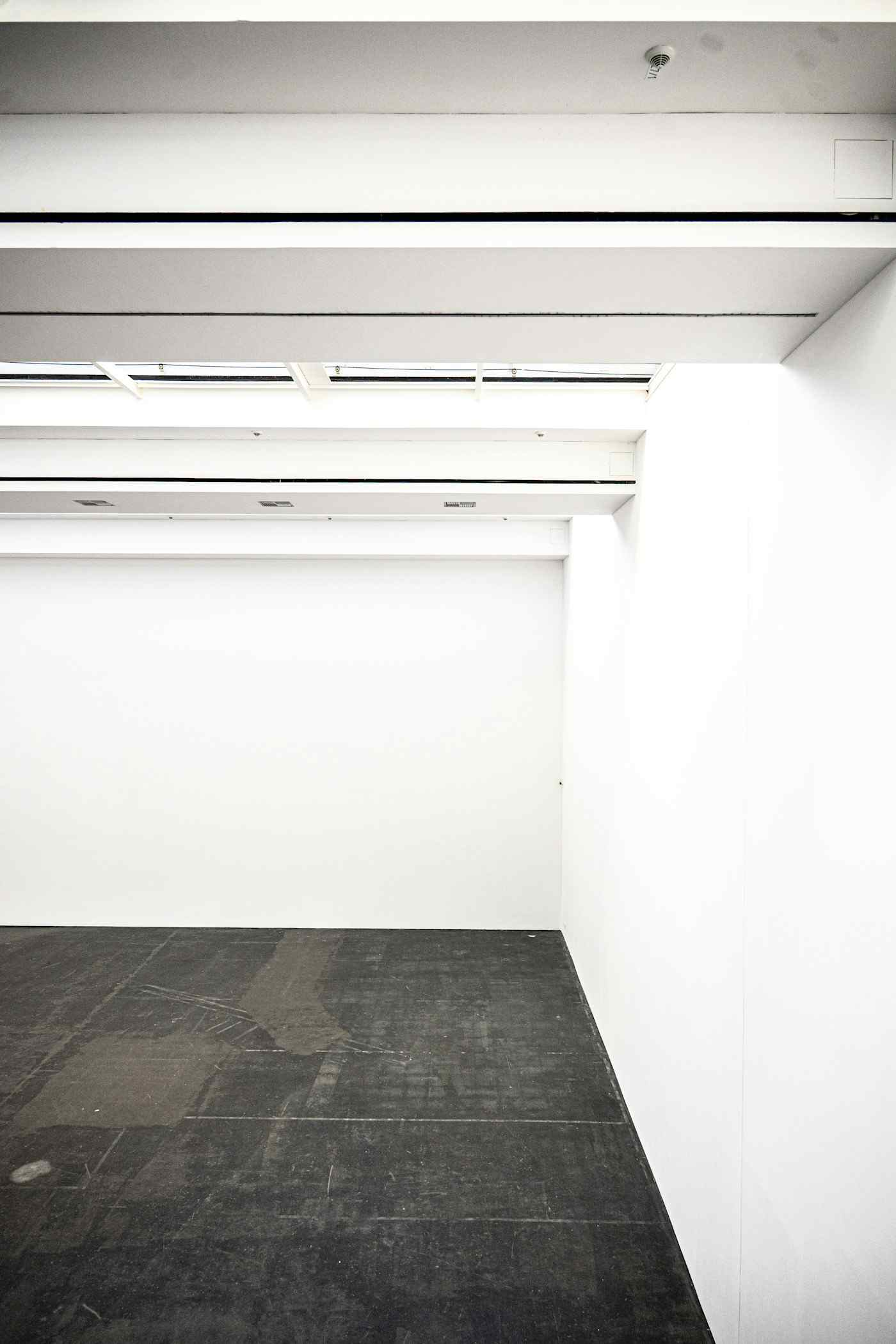 An empty white gallery room